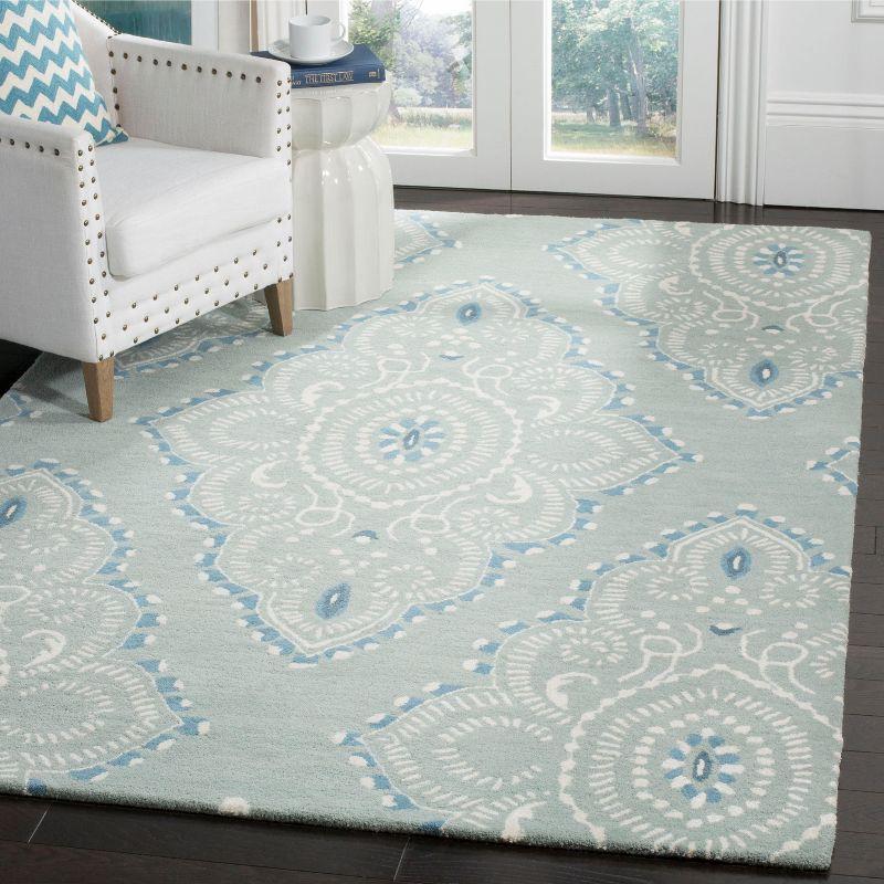 Hand-Tufted Blue and Ivory Wool Area Rug, 5' x 8'