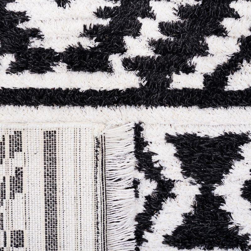 Nomadic Boho-Mod Black & Ivory Synthetic Area Rug - 6'4" x 9'6"