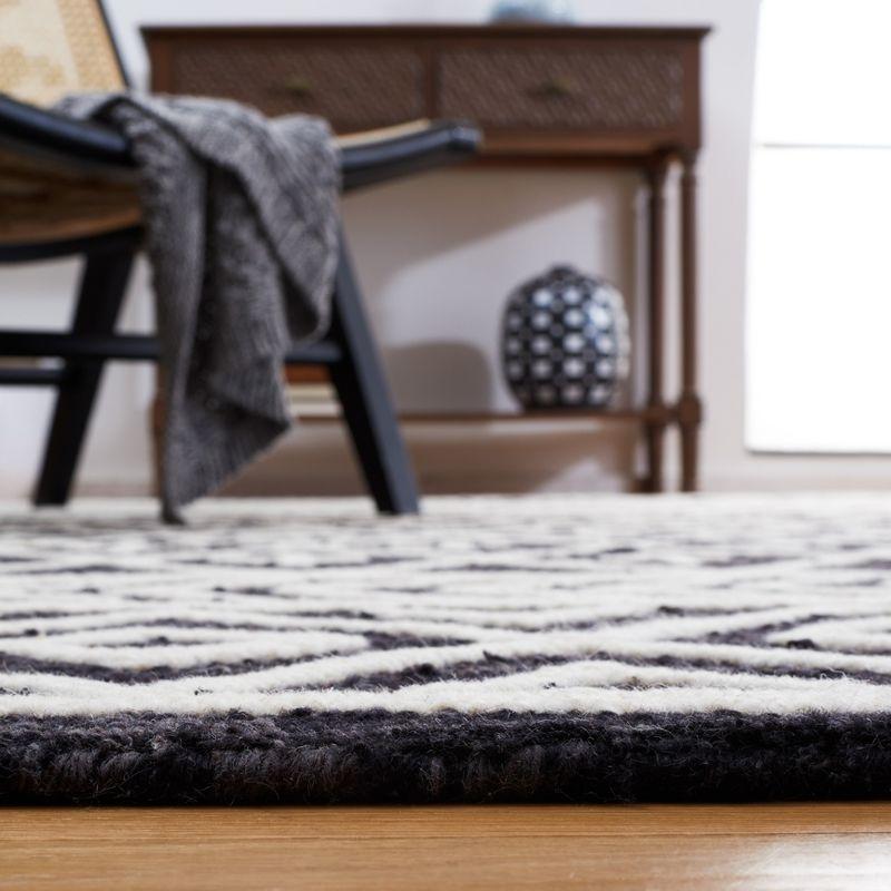 Handmade Black and Ivory Wool Tufted Area Rug, 8' x 10'