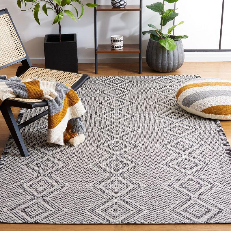 Augustine Black and Ivory Geometric Flat Woven 5' x 7' Rug