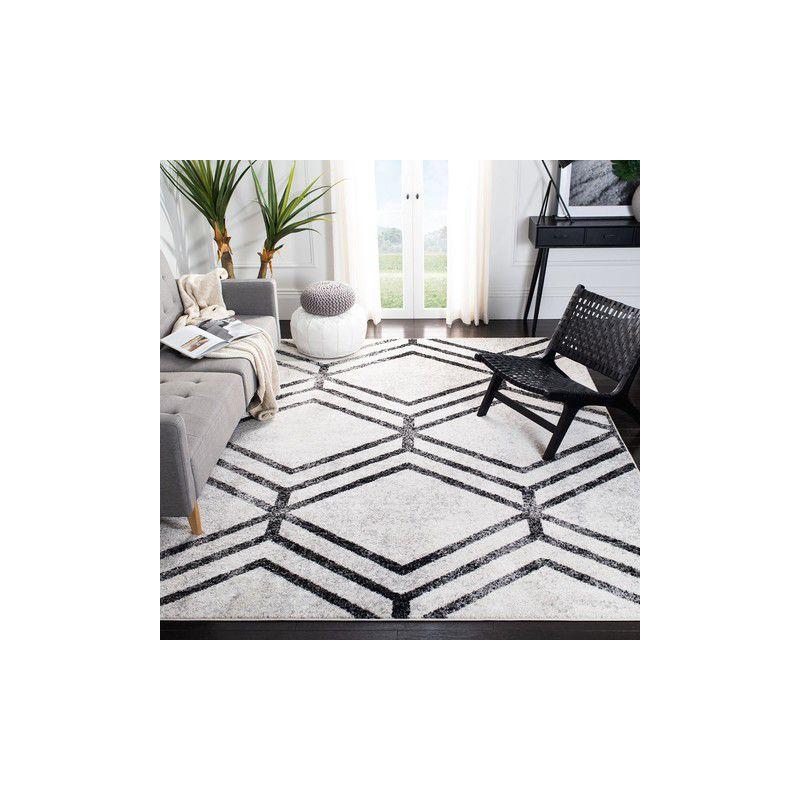 Ivory and Charcoal Geometric Synthetic Area Rug