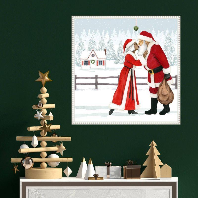 Santa and Mrs. Claus Kiss Under Mistletoe Framed Canvas Print