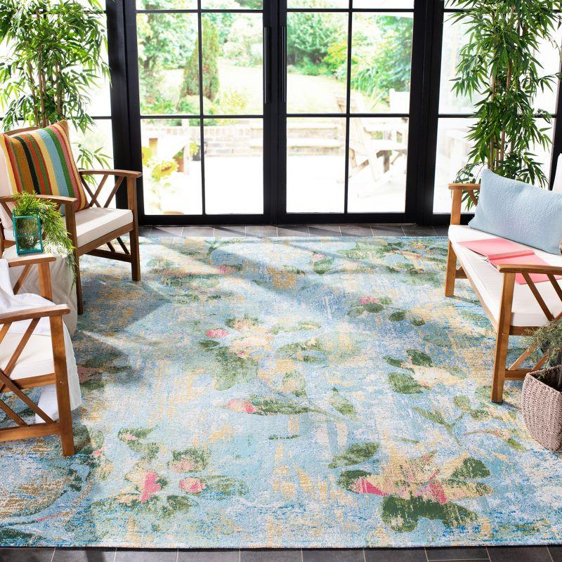 Lush Tropical Light Blue Floral 8' x 10' Synthetic Area Rug