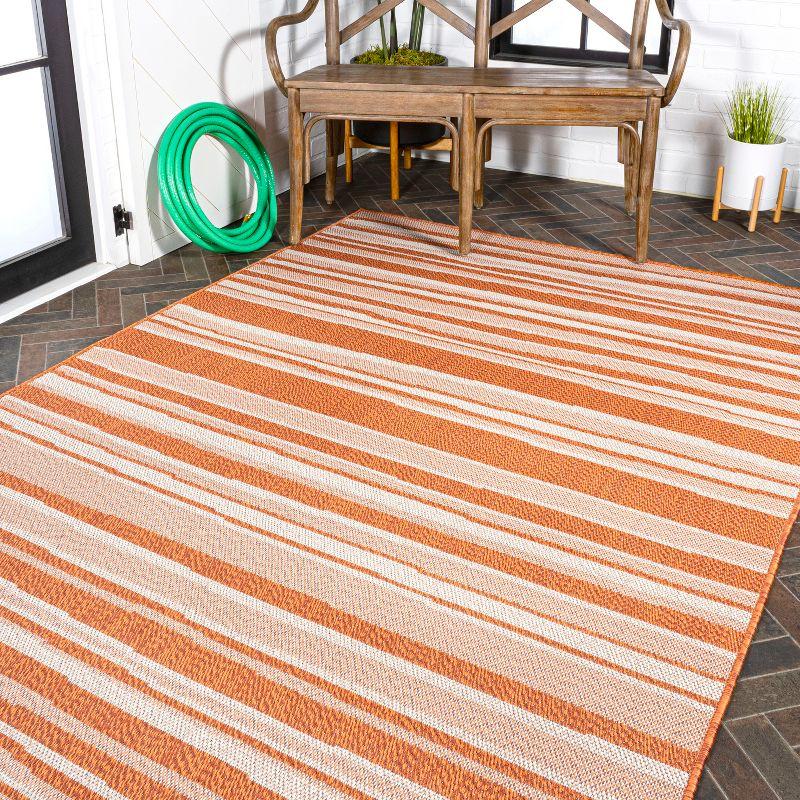 5' x 8' Castara Wavy Stripe Modern Indoor/Outdoor Area Rug, Orange/Cream - JONATHAN Y