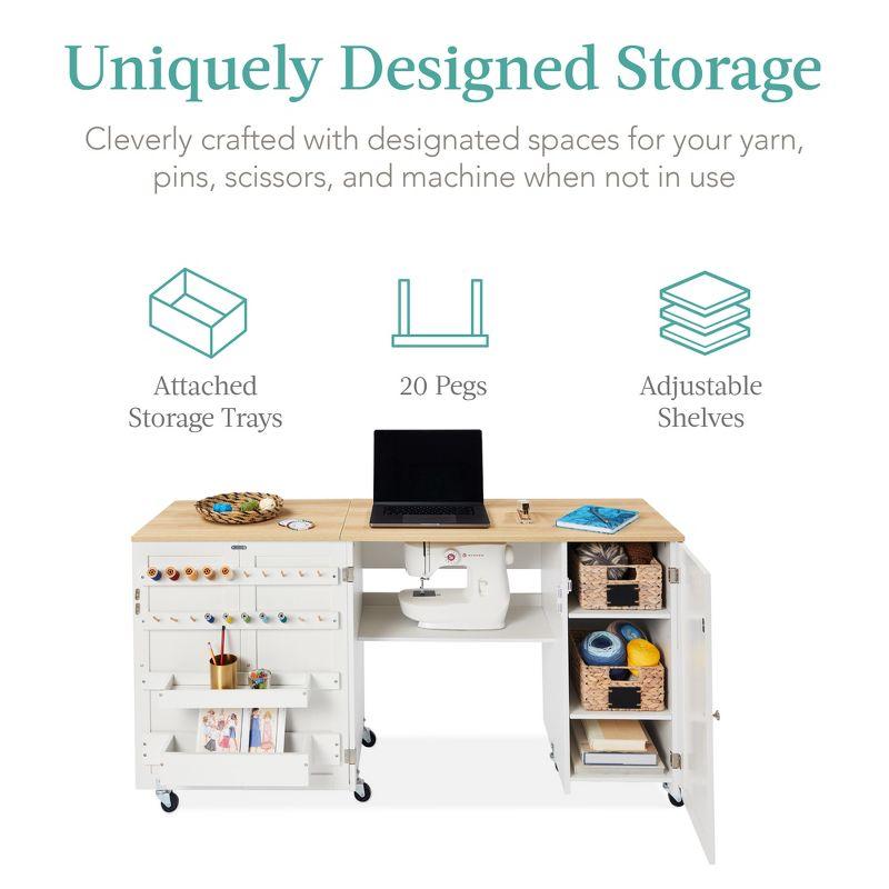 Compact White Folding Sewing and Craft Table with Storage and Caster Wheels