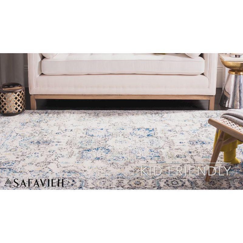 Turquoise and Ivory Square Synthetic Medallion Area Rug