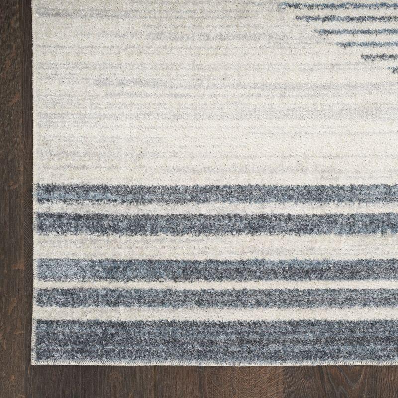 Nourison Astra Machine Washable Stripe Circle Mid-Century Modern Indoor Rug Ivory Blue 5'3" x 7'
