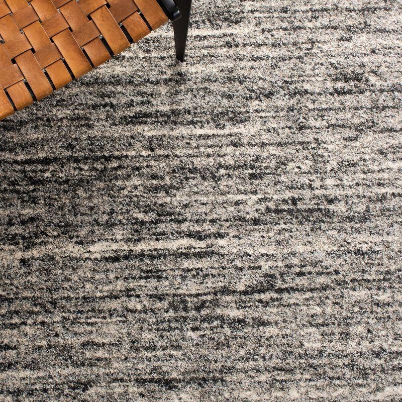 Ivory and Grey Abstract Synthetic Area Rug