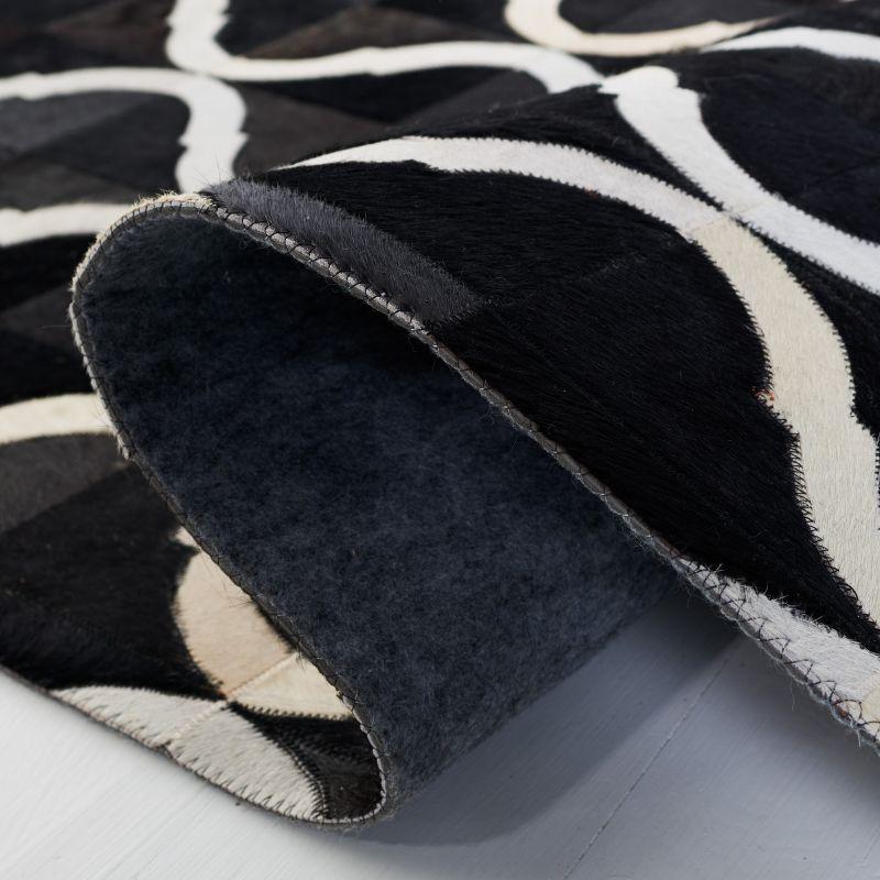 Handmade Black and Beige Geometric Cowhide Area Rug