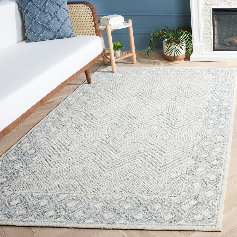 Ivory and Gray Hand Tufted Wool 4' x 6' Area Rug