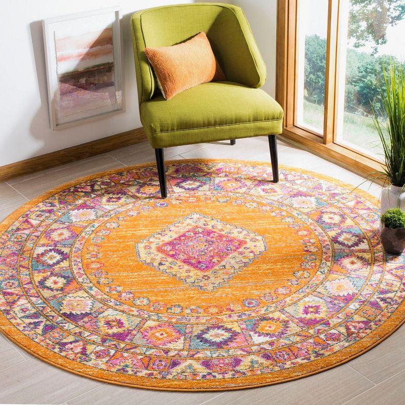 5'1" Round Orange and Fuchsia Synthetic Boho Chic Medallion Rug