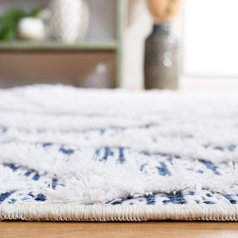 Ivory and Blue Nomadic Pattern 5' x 7' Synthetic Area Rug