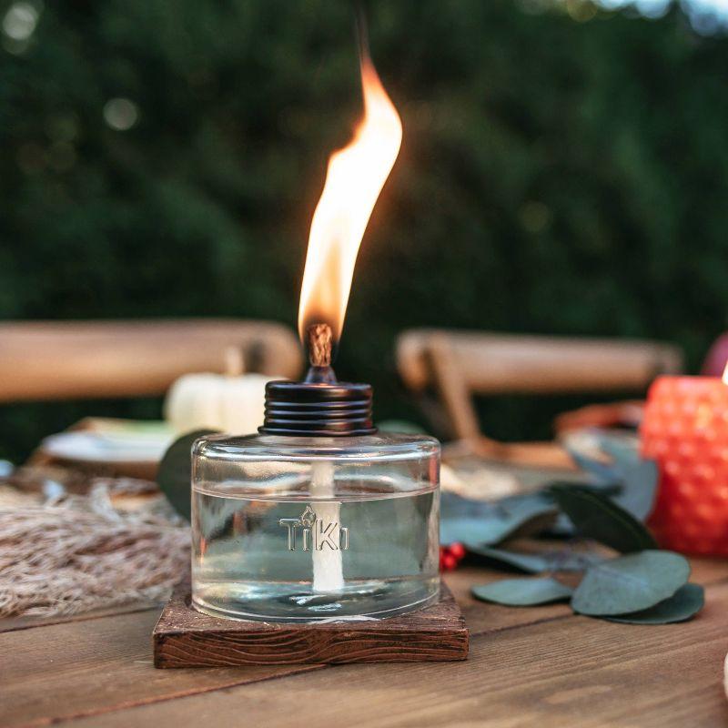 TIKI Mixed Material Tabletop Torch: Weather-Resistant, Smooth Finish, Refillable Fuel Canister, No Assembly Required
