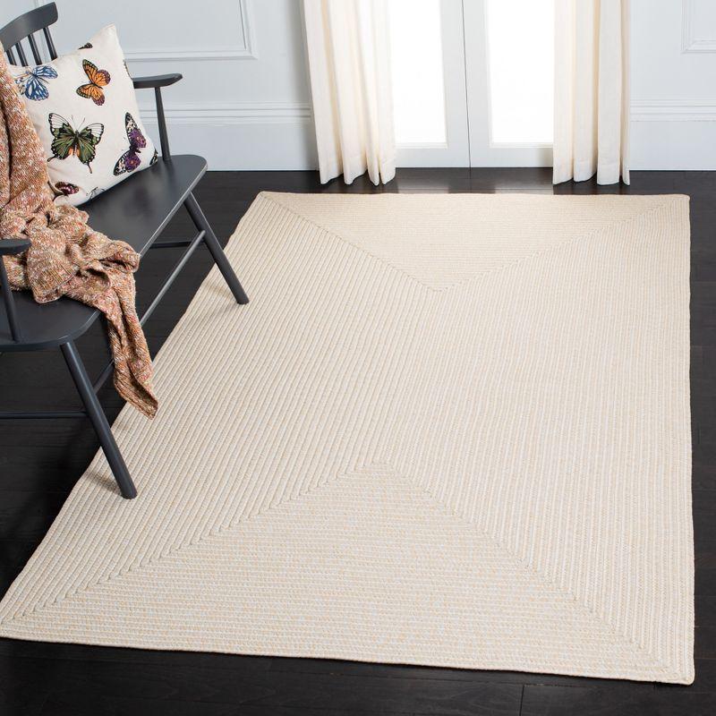 Handwoven Ivory Braided 5' x 8' Synthetic Area Rug