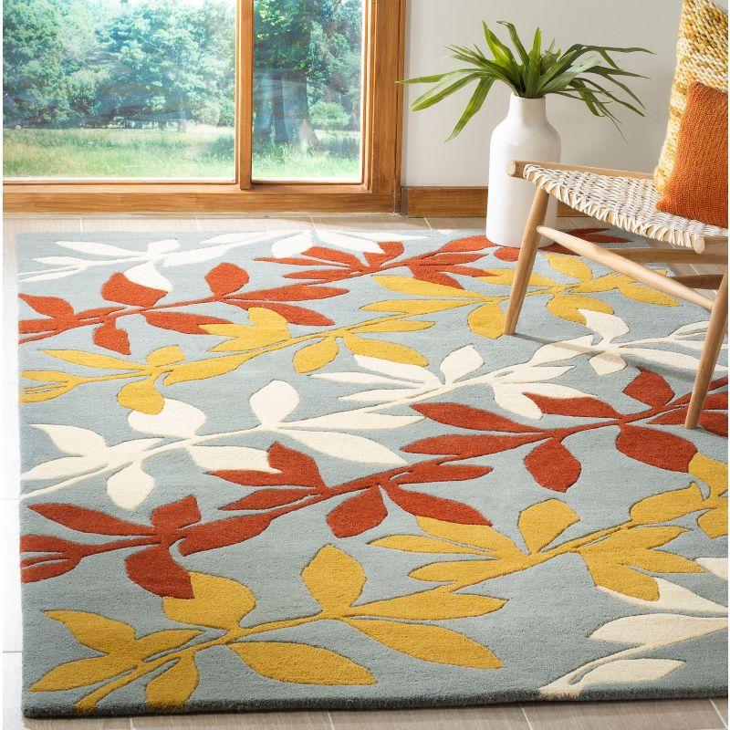 Handmade Tufted Blue and Multicolor Wool Area Rug