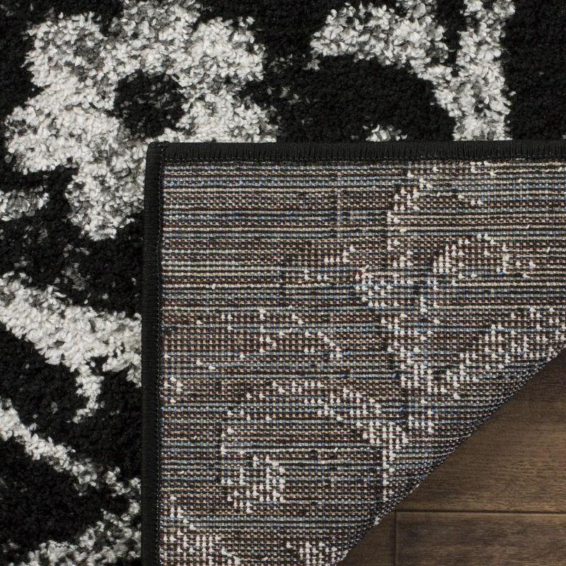 Elegant Black/Silver 9' x 12' Reversible Synthetic Area Rug