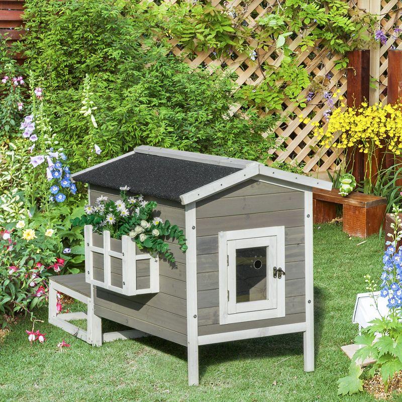 PawHut Wooden Wooden Cat House Feral Cat Shelter Kitten Condo with Escape Door, Porch and Flower Stand - Dark Gray/White