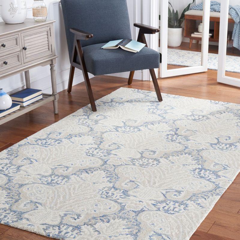 Blue and Ivory Handmade Wool 4' x 6' Area Rug