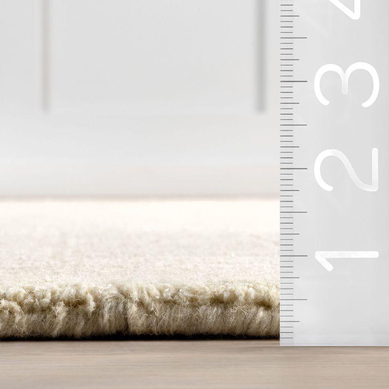 Latitude Run® Rune Bordered Wool-Blend Area Rug