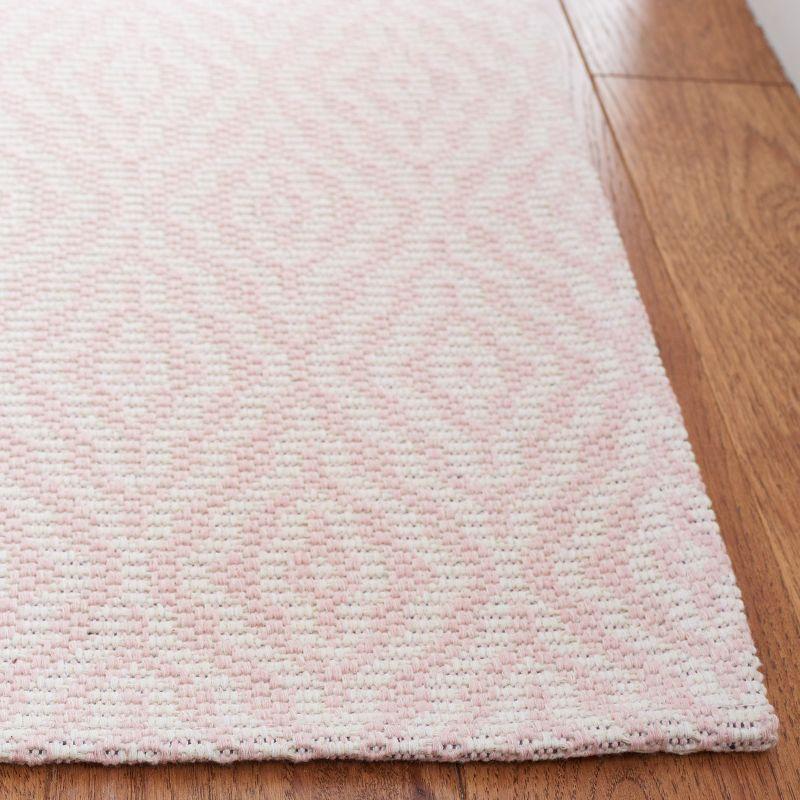 Handmade Pink and Ivory Wool 5' x 7' Reversible Braided Rug