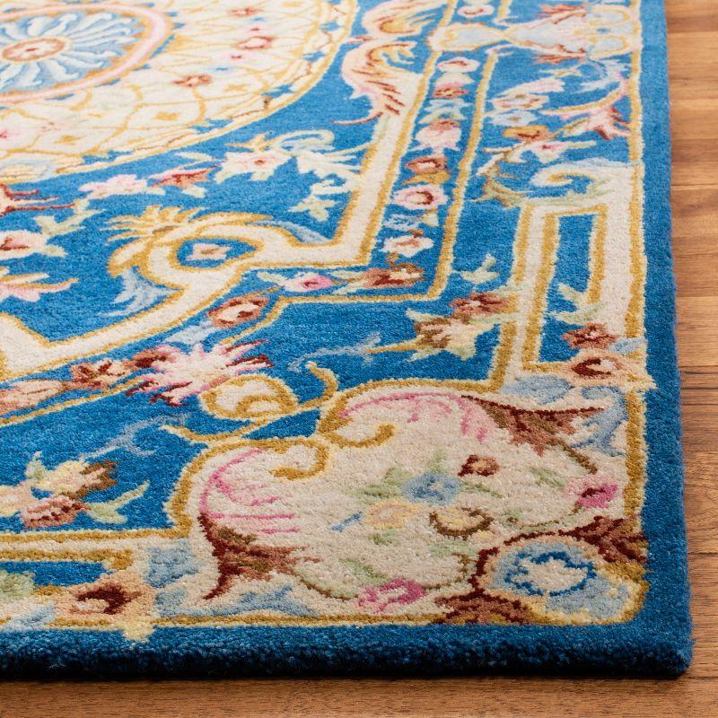 Handmade Blue and Ivory Floral Wool 8' x 10' Area Rug