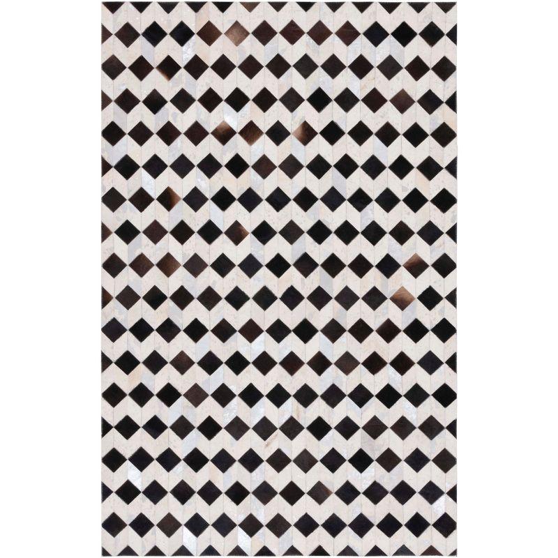 Handmade Black and Beige Geometric Cowhide Rug