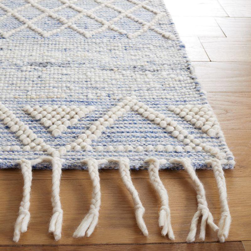 Ivory and Blue Handwoven Wool Area Rug with Fringe