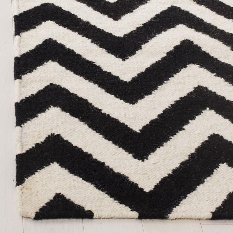 Dhurries DHU557 Hand Woven Flat Weave Accent Rug Black / Ivory 3' X 5' - Safavieh.