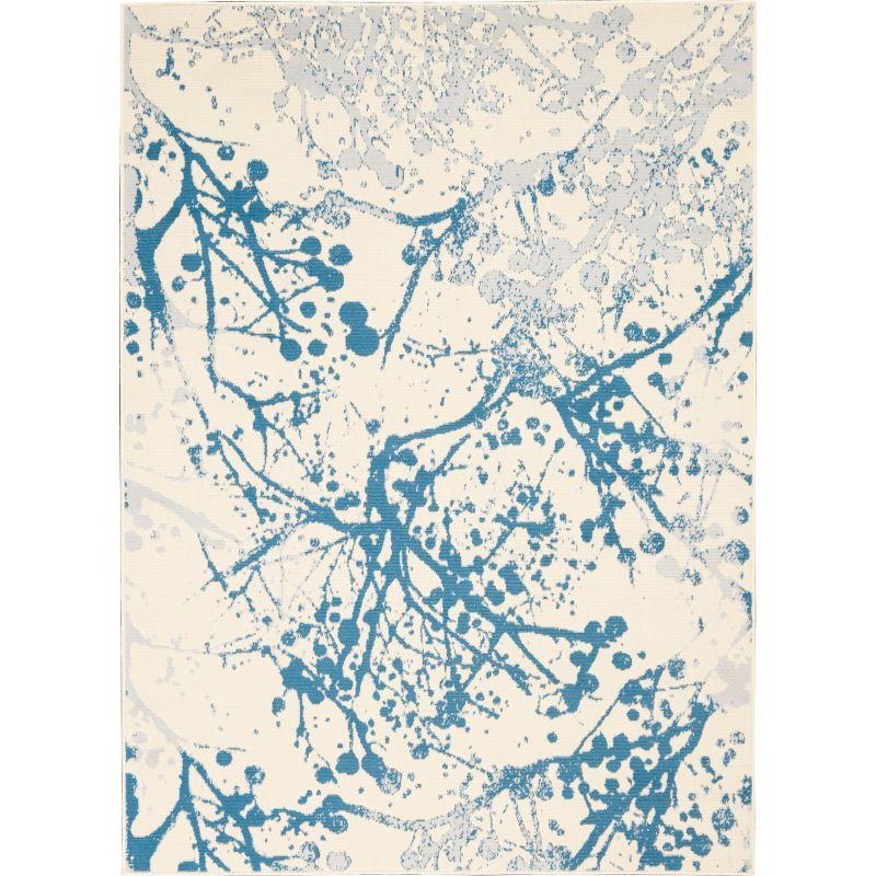 Ivory and Blue Abstract Synthetic 4' x 6' Easy-Care Area Rug