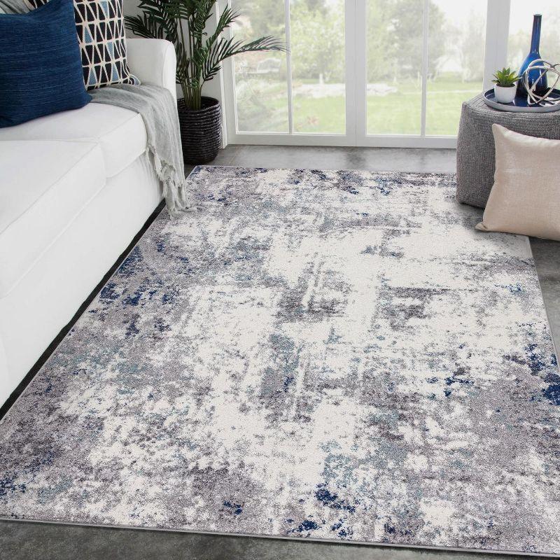 Abstract Ivory Synthetic 5' x 7' Easy-Care Area Rug