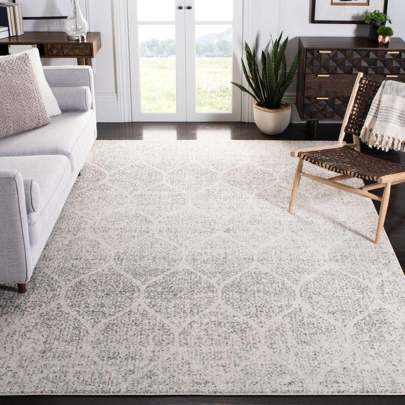 Ivory and Silver Geometric 8' x 10' Synthetic Area Rug