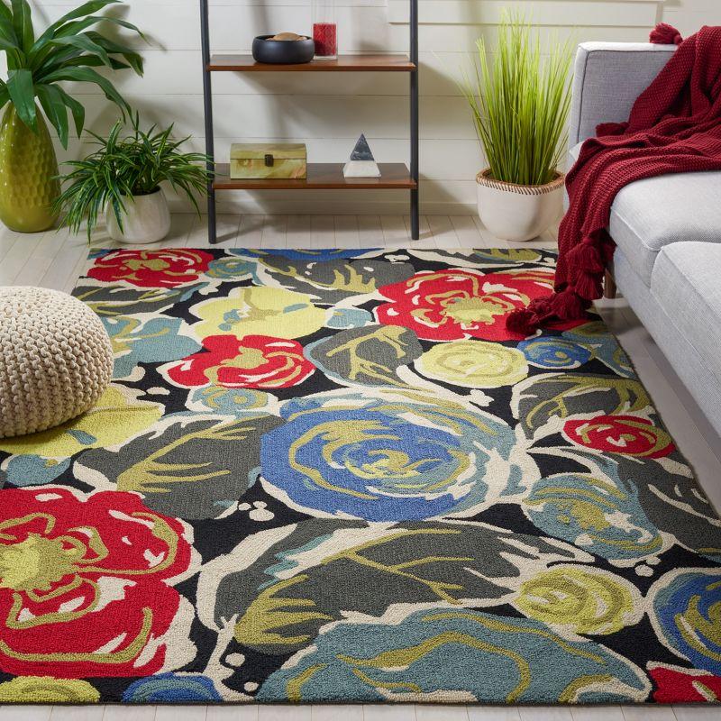 Handmade Black Floral Rectangular Synthetic Area Rug