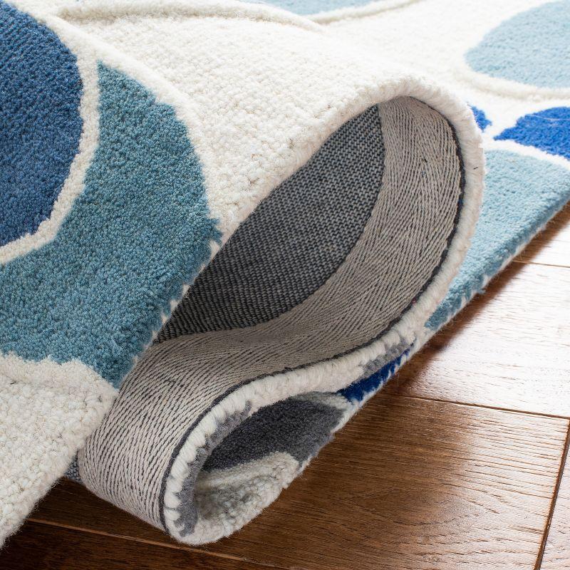 Safavieh Kids SFK923 Hand Tufted Area Rug - Ivory/Blue - 3'x5' - Safavieh.