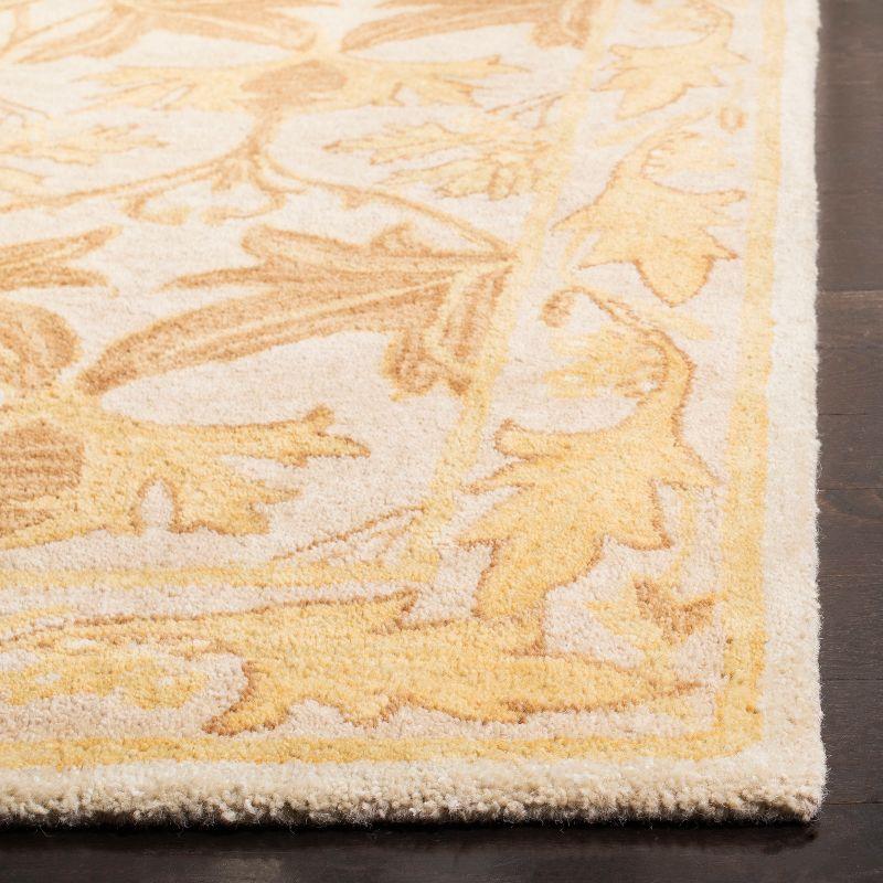 Elegant Ivory and Gold 4' x 6' Hand-Tufted Wool Area Rug