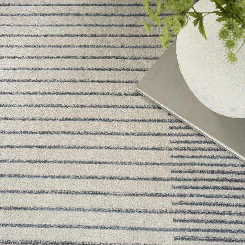 Nourison Astra Machine Washable Stripe Circle Mid-Century Modern Indoor Rug Ivory Blue 5'3" x 7'
