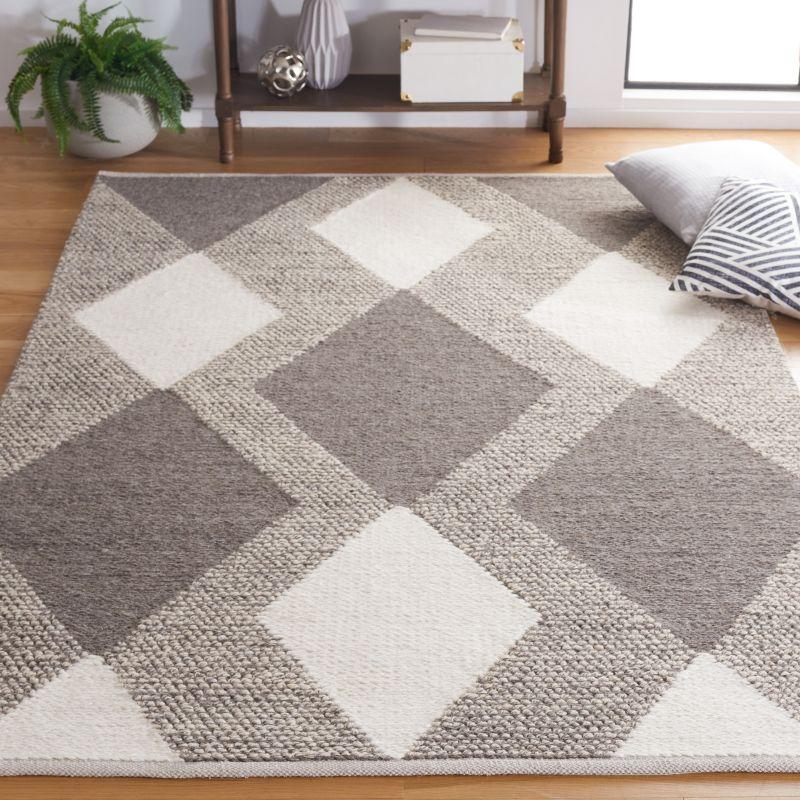 Ivory and Beige Hand-Woven Wool Area Rug - 3' x 5'