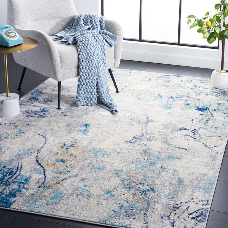 Ivory Abstract Synthetic 8' x 10' Easy-Care Area Rug