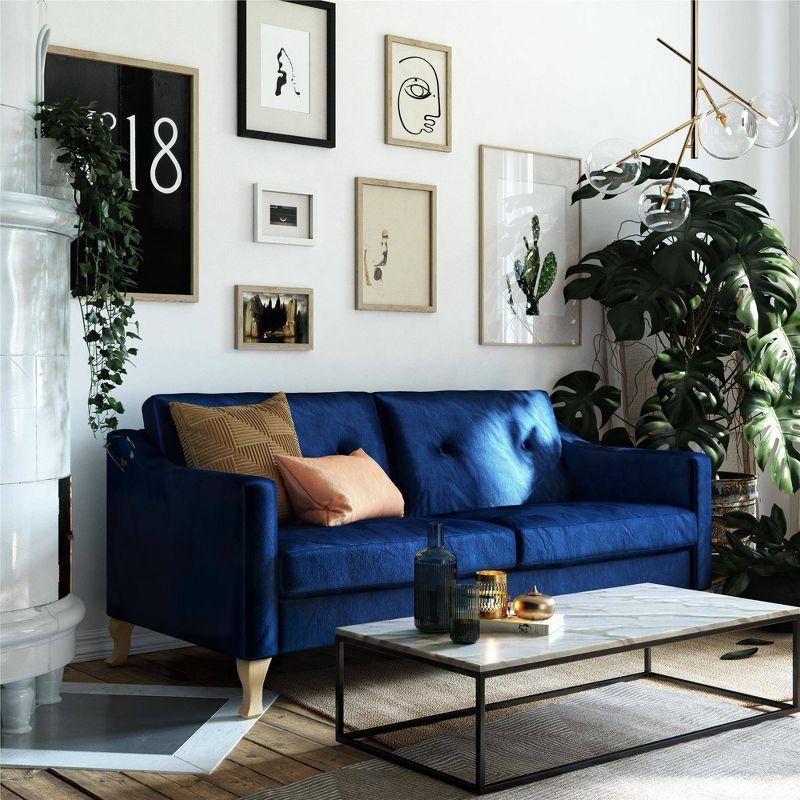 Luxe Blue Velvet Tufted Sofa with Sloped Arms and Wood Accents