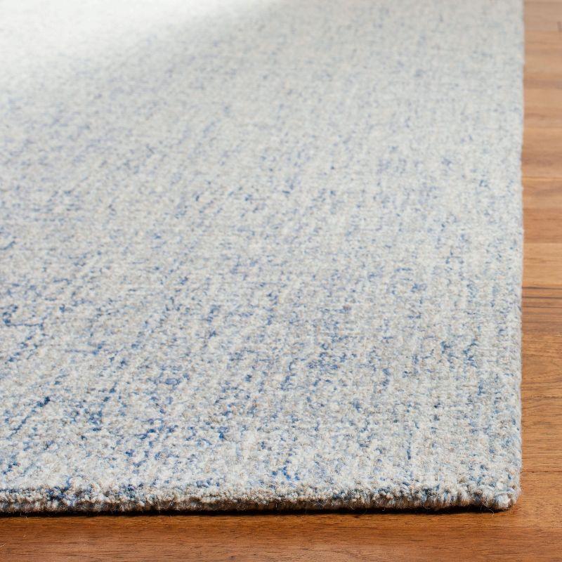 Ivory and Blue Abstract Hand-Tufted Wool Accent Rug - 27" x 4"