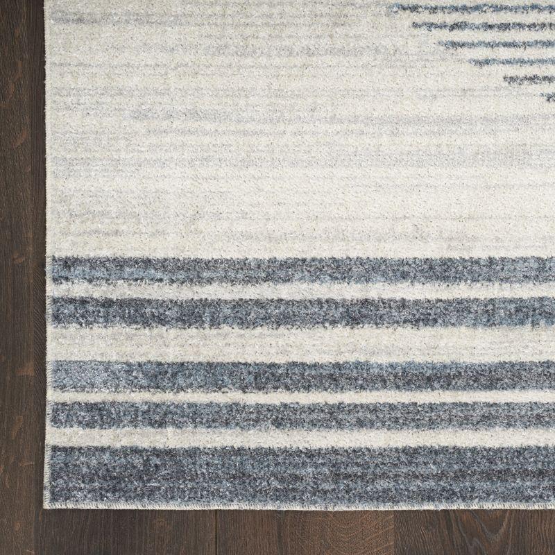 Nourison Astra Machine Washable Stripe Circle Mid-Century Modern Indoor Rug Ivory Blue 5'3" x 7'