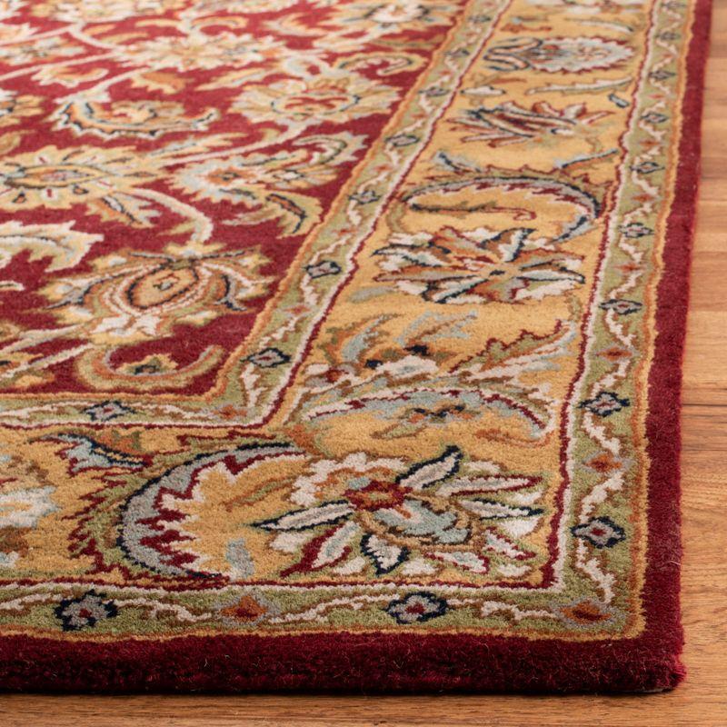 Classic CL758 Hand Tufted Area Rug - Red/Gold - 5'x8' - Safavieh.