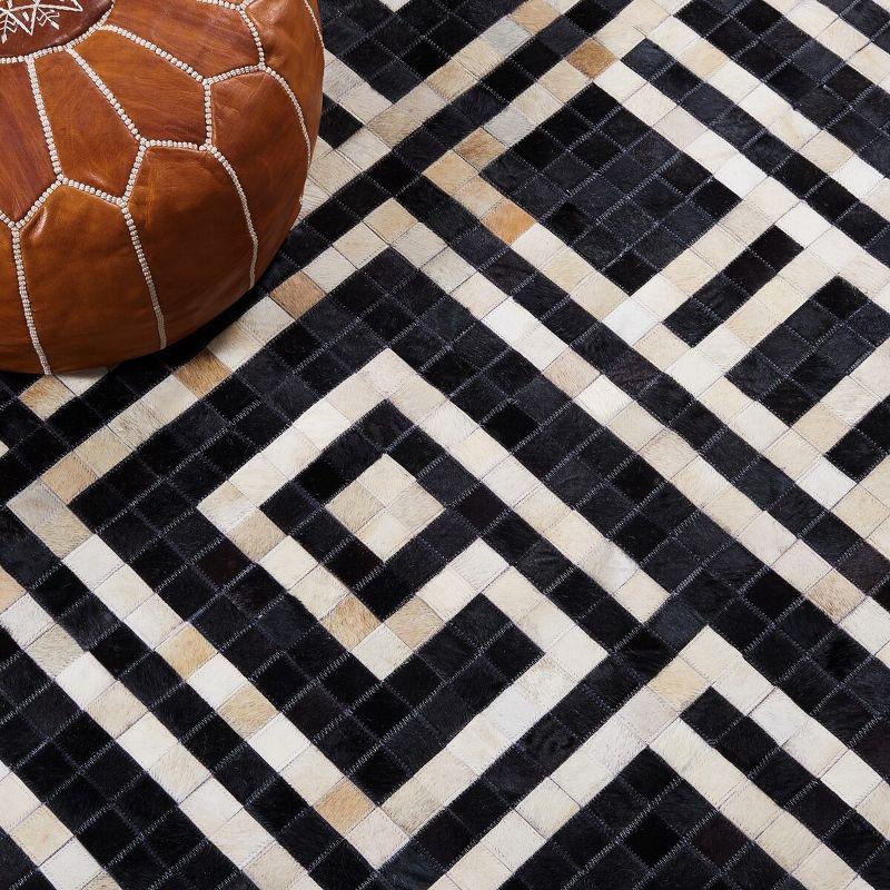 Handmade Black and Ivory Geometric Cowhide Area Rug