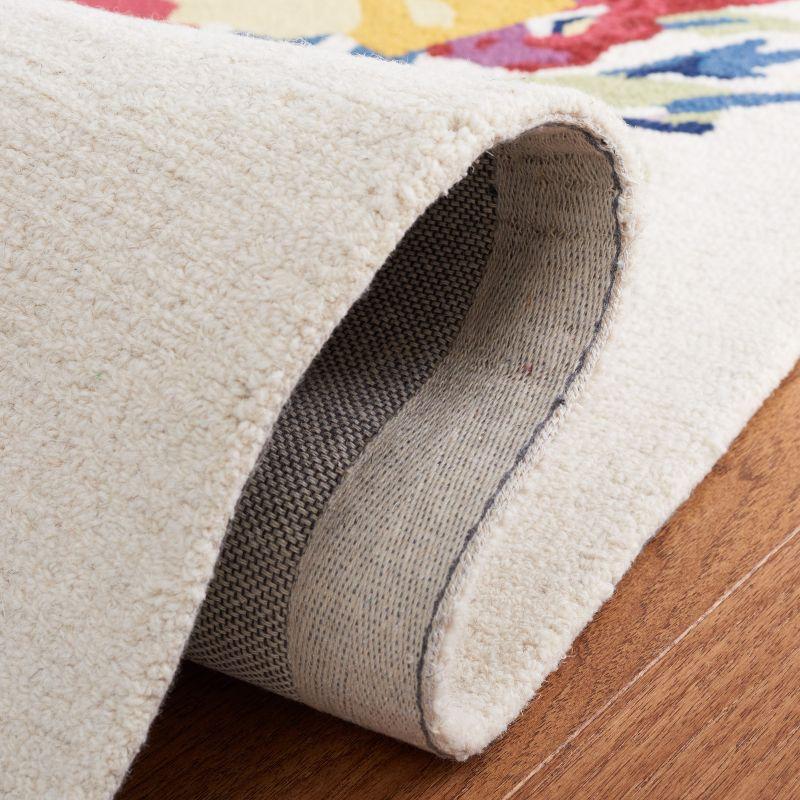 Chelsea HK219 Hand Tufted Area Rug - Ivory/Rose - 5'x8' - Safavieh.