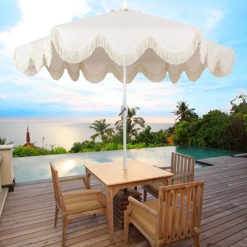 JONATHAN Y Collins 9 ft. Classic Cottage Tassel Market Patio Umbrella with Auto-Tilt, Crank, Wind Vent and UV Protection in Cream