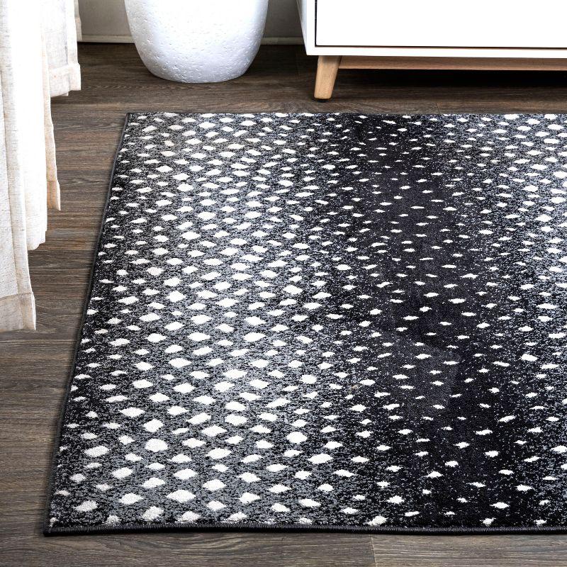 Abstract Antelope 8' x 10' Black and Ivory Synthetic Area Rug