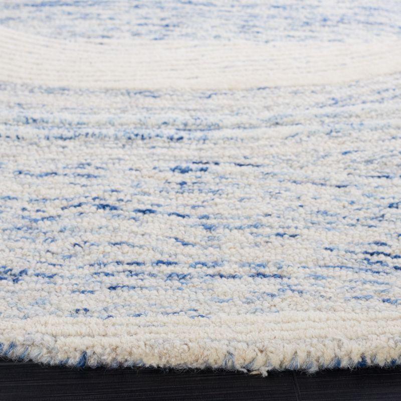 Round Blue and Ivory Tufted Wool Area Rug