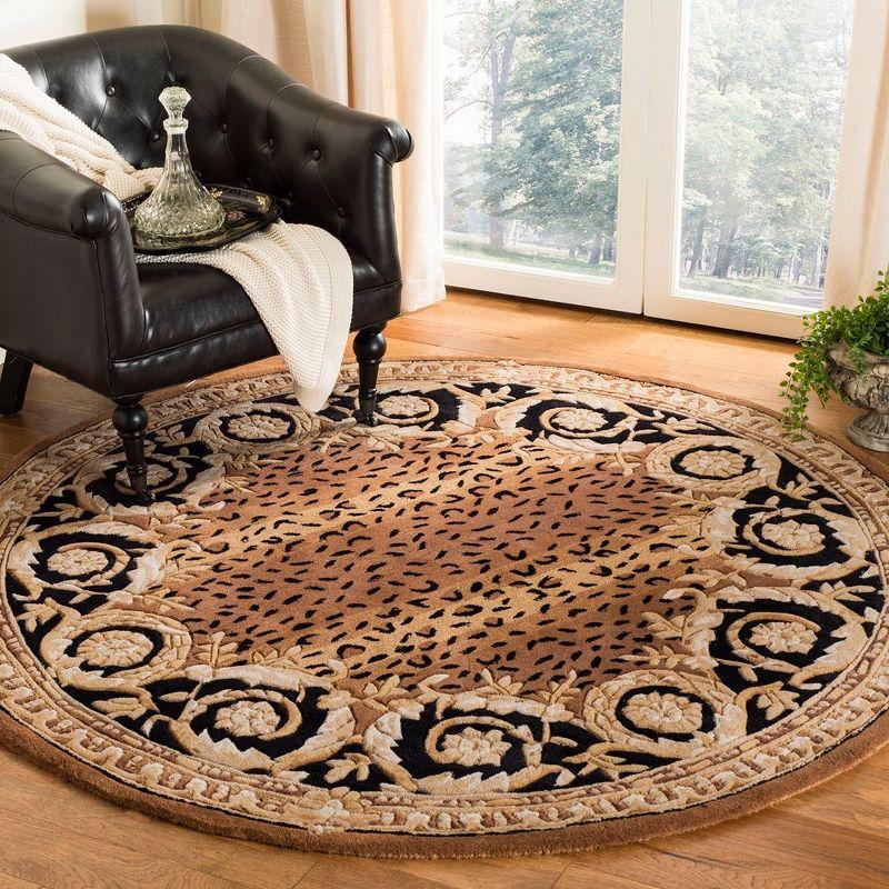 Naples NA712 Hand Tufted Area Rug - Black/Gold - 8' round - Safavieh.