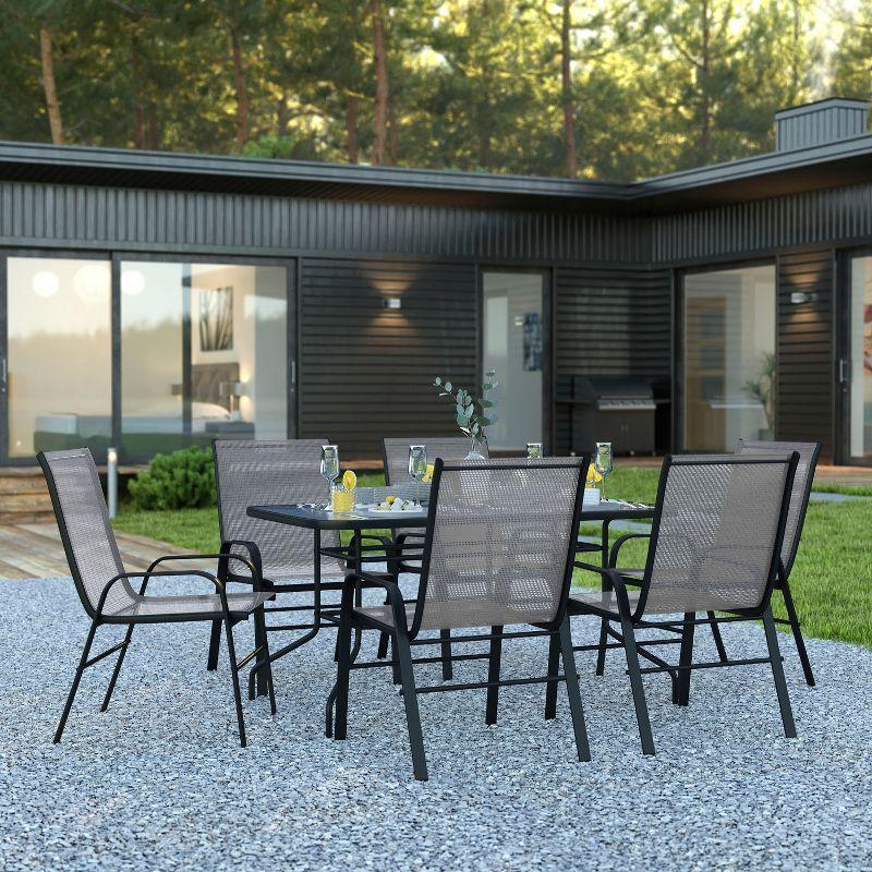 Flash Furniture 7 Piece Outdoor Patio Dining Set - 55" Tempered Glass Patio Table with Umbrella Hole, 6 Gray Flex Comfort Stack Chairs