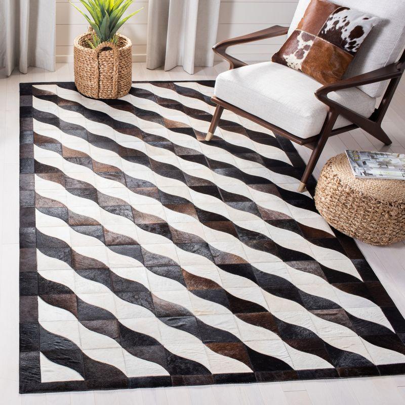 Handmade Black Geometric Cowhide Area Rug