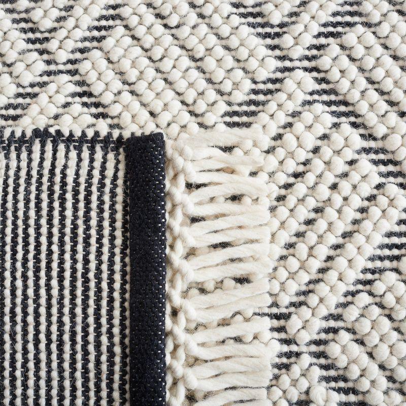 Handwoven Ivory and Black Wool 4' x 6' Area Rug